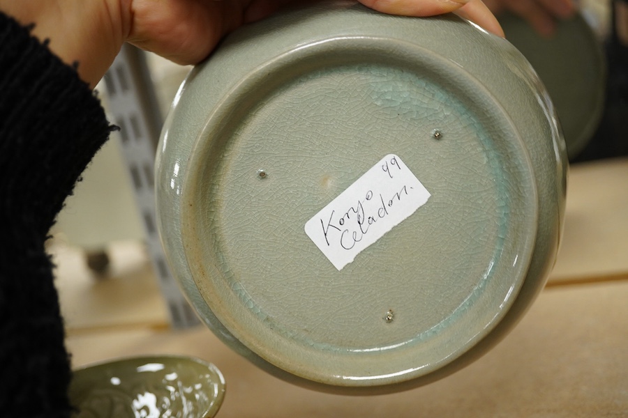 A Chinese celadon glazed box and cover and two similar bowls, largest 15cm diameter. Condition - varies